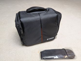 Camera carrying bag with shoulder strap 