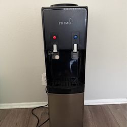 Primo water dispenser w/ 2 glass five gallon jugs