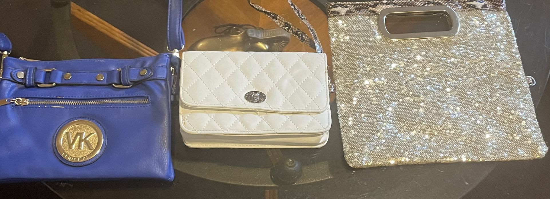 One Micheal Kors Hand Bag, One Small Wallet & A Nice Little Glittery Makeup Bag