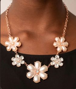 Brand new beautiful flower necklace and earrings set ( never used still sealed in package never open ).