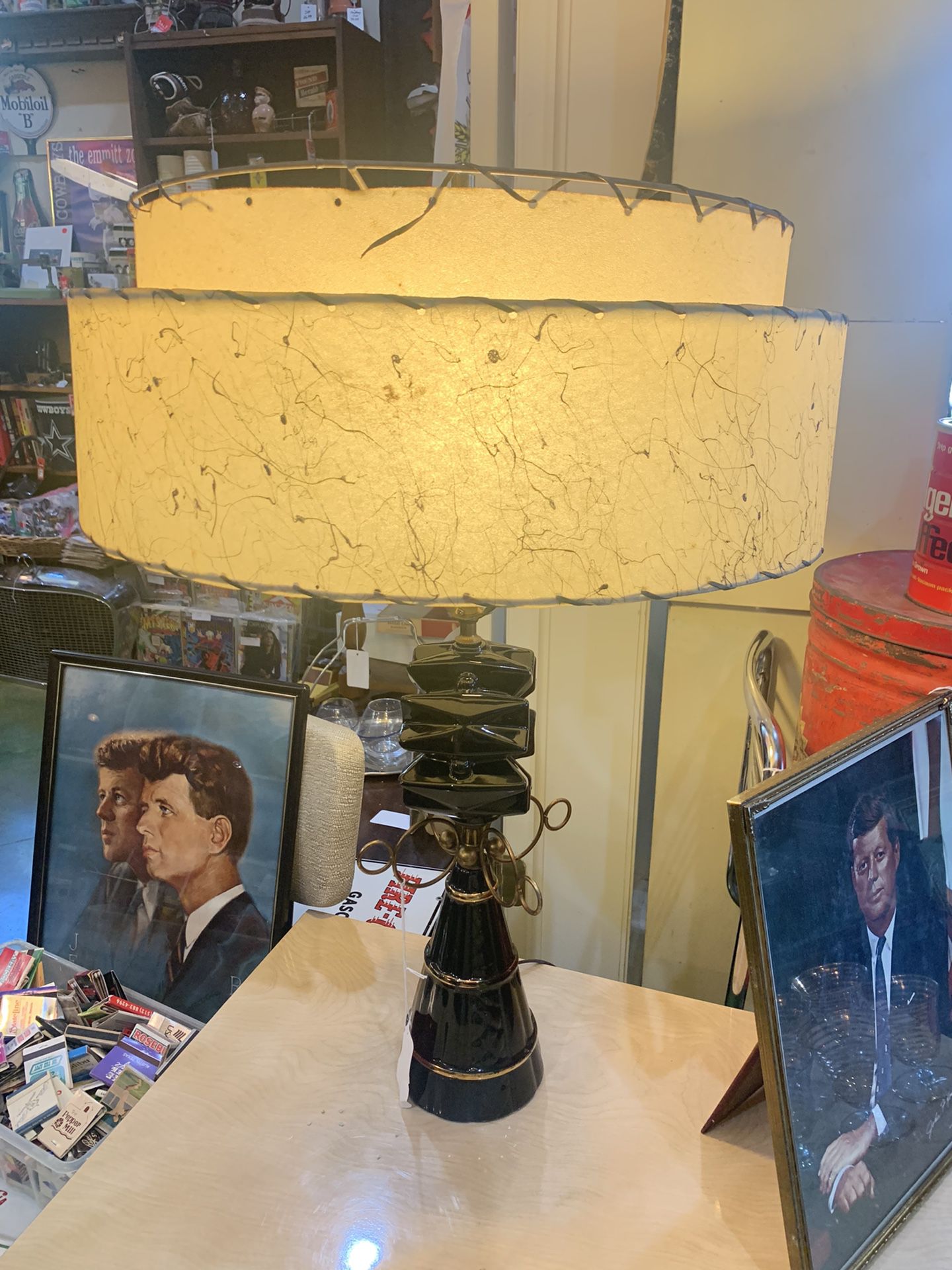 21x30 mid-century modern 1950s black and gold lamp. Original shade. 125.00. Johanna at Antiques and More. 316b Main Street Buda. Antique vintage furni