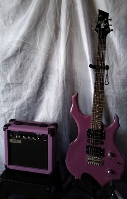Brand new electric guitar with 20 watts amp bag cable and shoulder strap