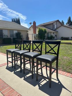 Black faux leather bar stool with X-shaped backrest, 4 for $150