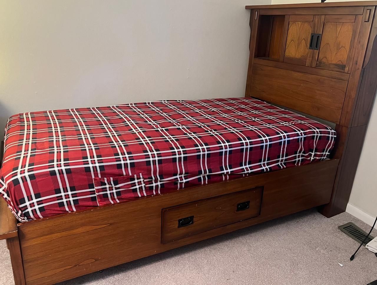 Twin bed frame with 3 storage drawers on 3 sides & with storage headboard.