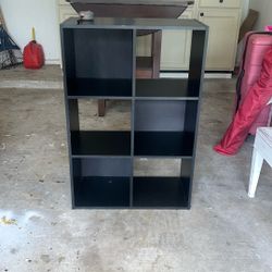 For Sale: Black Cubby Shelf – Versatile Storage!