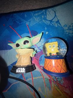 Baby Yoda Funko pop and SpongeBob globe