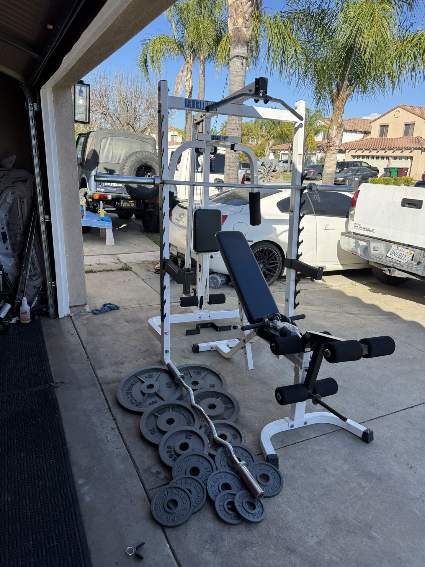 Para body commercial squat rack/bench press with pulleys system and 7ft 45lbs bar plus 255lbs of Olympic weights and curl bar