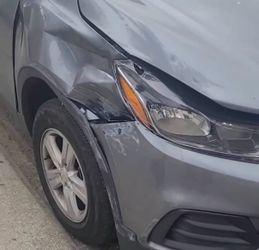 Gray SUV with Front End Collision Damage