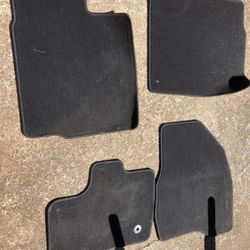 Carpet OEM car mats for a 2013 Ford Explorer.