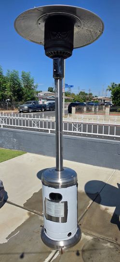 2 stand up Patio Heaters with Propane bottles