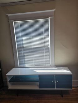 Liberty  Aqua Blue TV Stand can hold TV's up to 60"