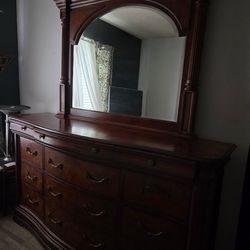 Brown dresser with matching vanity