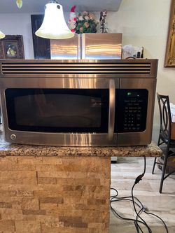 GE Stainless Steel Over-the-Range Microwave 17 inches tall 15 inches deep 30 inches wide
