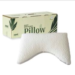 Nest Bedding Easy Breather Memory Foam Pillow Side Sleeper.

This is still brand new in vacuum sealed bag in the box.