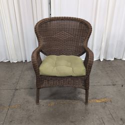 Brown Wicker Accent Chair with Green Cushion