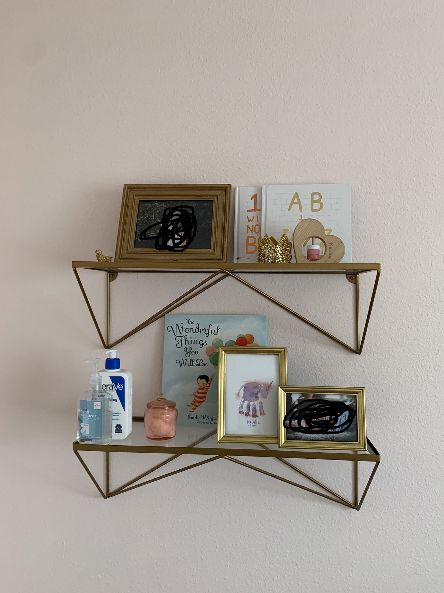 Two gold shelves with glass