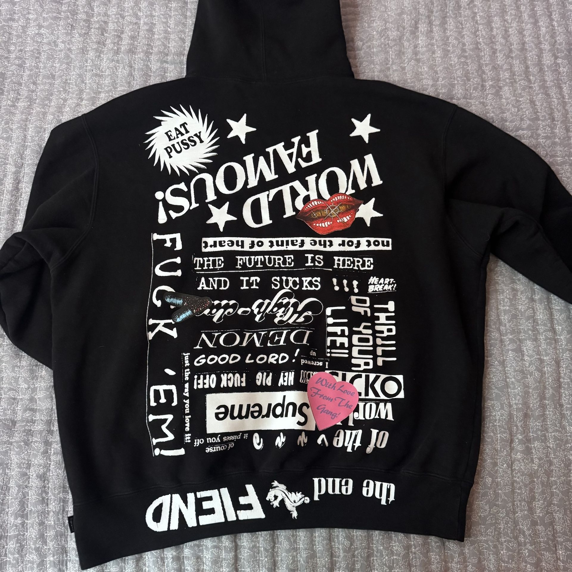 Supreme® “World Famous” Graphic Hooded Sweatshirt – Black / Size M