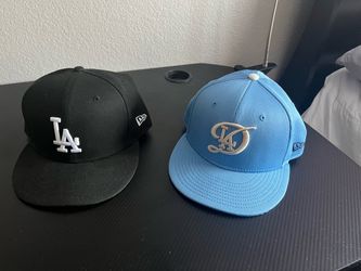 2 Dodger Caps - one new , one lightly used