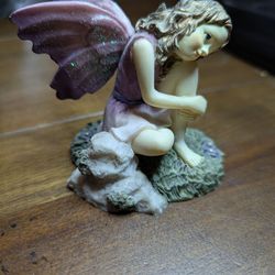 "Pondering" fairy by Dezine