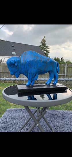 The old blue buffalo statue