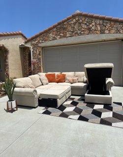 Delivery Available! Light colored Sectional Sofa with Pull-Out Sleeper and Storage Ottoman.