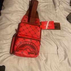 Red crossbody spray ground bag