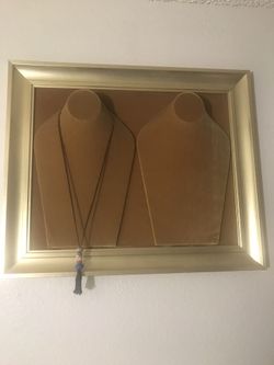 Beautiful gold frame with gold velvet wall jewelry display