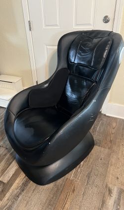 black Benzara BM197622 Curvy Massage Chair with Bluetooth Speaker.