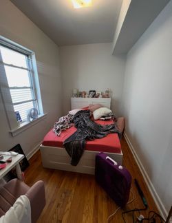 Full size white bedframe and bookshelf headboard