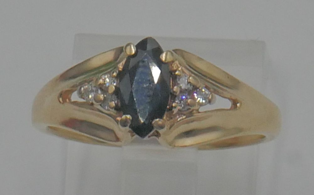 10KT YELLOW GOLD RING SIZE 6.75 2.8 GRAMS 6 DIAMONDS 1 BLUE STONE. 878718-4.