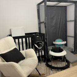 Nursery Furniture : Black Mini Crib, Mattress, Rocking Chair And pillow, Gray Play Pen, Grey Soft Play Blocks, Walker, Changing Mat, Travel Carrier 