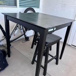 Black Wooden Table With Bar Stools