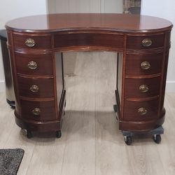 Antique mahogany kidney shaped 8 drawer desk