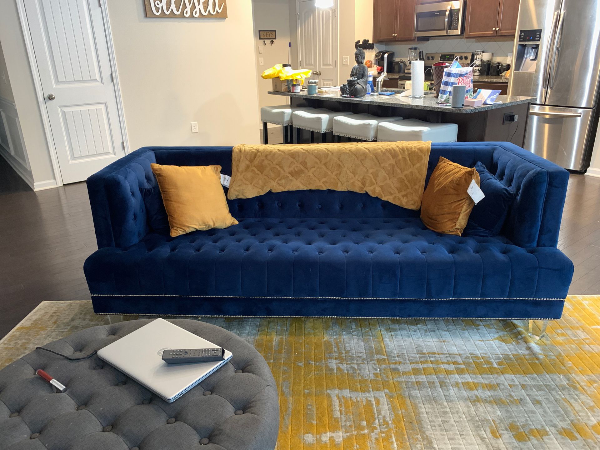 Royal Blue velvet tufted couch.
