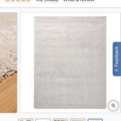 Open box, new Thomasville Marketplace Luxury Shag Rug Collection, 9’5” x 13'. Cream color.