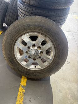 8 spoke Chevy rim and tire LT265/70/r18