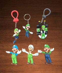 NINTENDO LUIGI FIGURE LOT OF 6 TOYS.