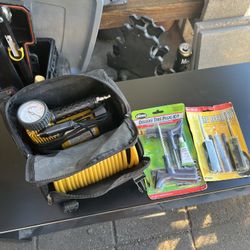 portable 12V air compressor kit and tire repair plug kits.