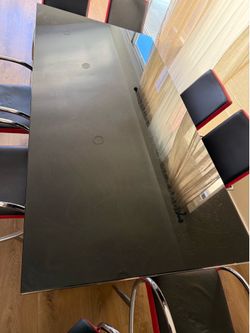 Glass table metal w/ 8 chairs obo