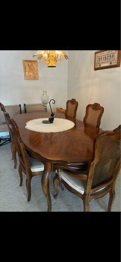 Dining Room Set. French  provincial. 6 chairs. Oval shape table. China Closet nut the context inside. Buffet extension opening on the top. Cash and ca