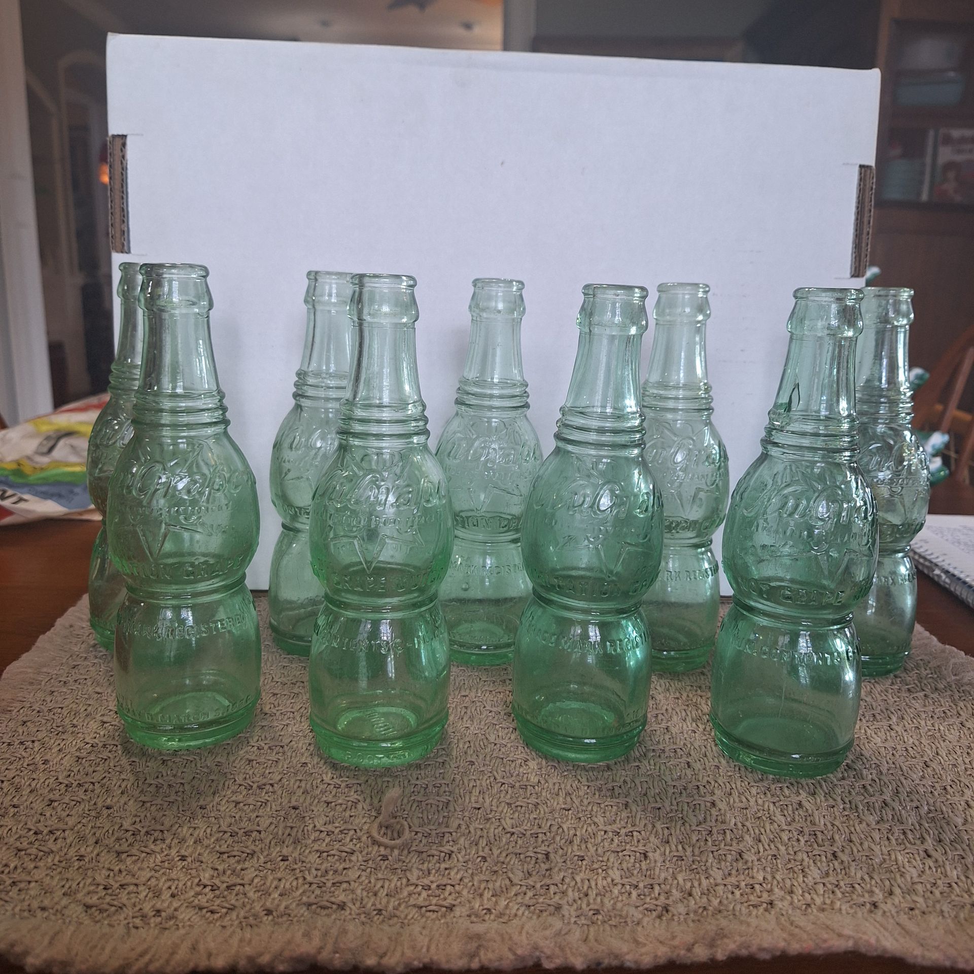 LARGE COLLECTION OF ANTIQUE NUGRAPE SODA BOTTLES