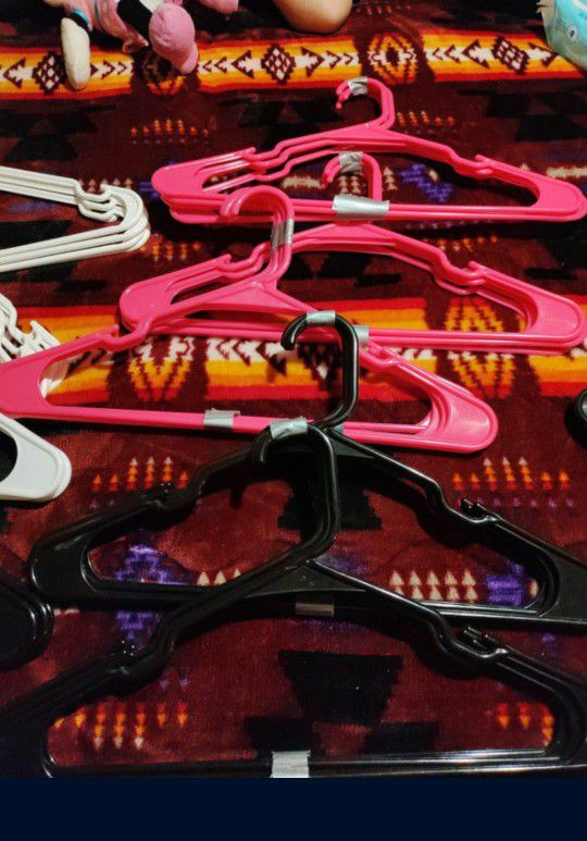 Plastic Hangers Pink Black And White Color , Good Condition 48 Hangers Total $5 . PICK UP ONLY NO HOLDS. 