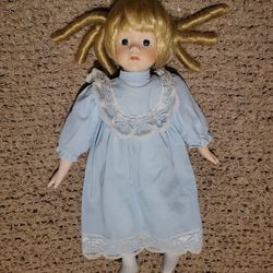 VINTAGE PORCELAIN DOLL WITH BLONDE HAIR CURLS 