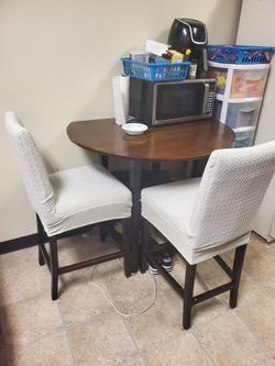 Foldable round dining table with two chairs $80