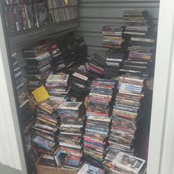 Storage unit filled with dvds and CDs.