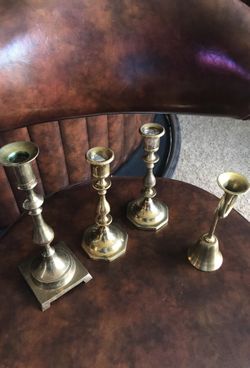 Brass’s best! 3 brass candle holders!! 2- 7 inch candle holders and tall brass 8 3/4 inches tall. Brass bell 6 1/2