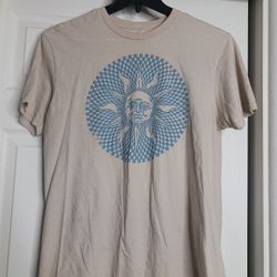 The Mad Engine T-shirt is a unisex celestial sun graphic t-shirt in size M, featuring a checkered design in neutral and blue colors. Made of comfortab