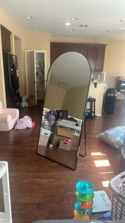 Metal arch mirror