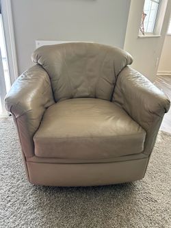 Tan leather swivel chair
