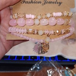 Pink Beaded Stretch Bracelets With Carm And Tassle